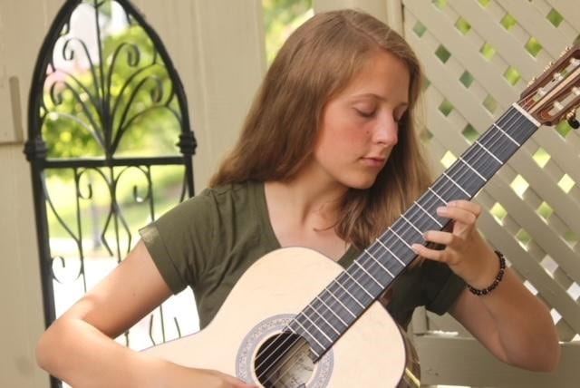 Award winning guitarist Caitlin Robinson practices in her backyard in June 2019. When getting ready for competitions, Robinson will practice from four to six hours a day. 