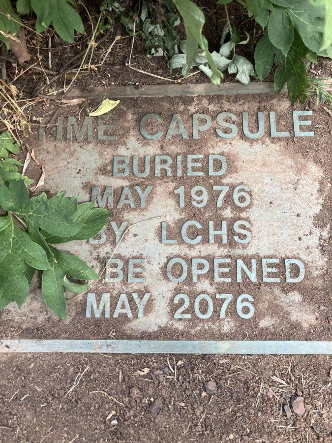 The plaque by the flagpole. The capsule is buried beneath, not to be opened until May of 2076. Photo by Emily Banner.