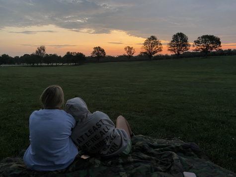 Senior Mairenn Blest and Kenly Howerter sit on the Ida Lee field as they watch the sunrise. At approximately 6:45 a.m. seniors met at the Ida Lee Recreation Center to celebrate their last first day of high school and watch the sunrise. (Photo courtesy of Kenly Howerter)

