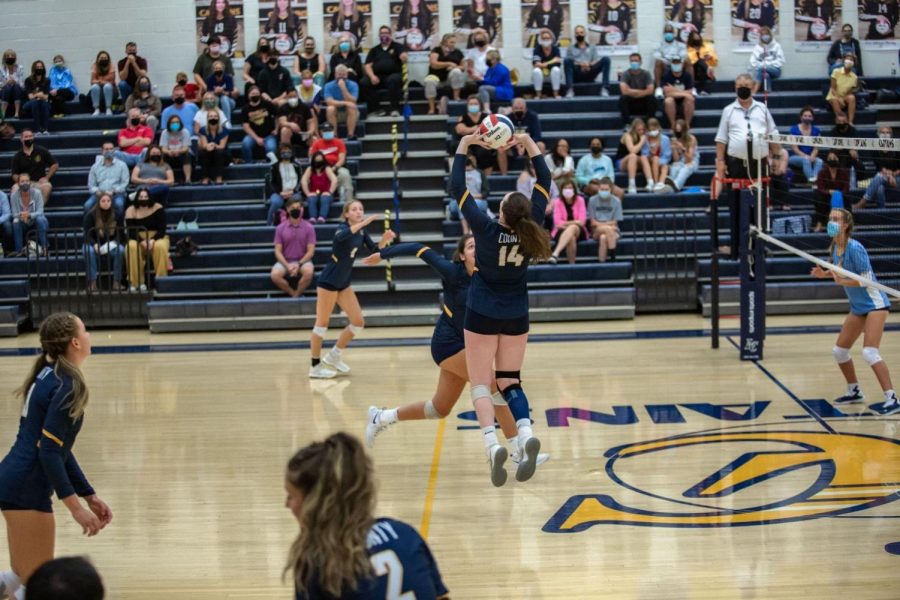 Loudoun+County+plays+Lightridge+in+a+home+varsity+volleyball+match+in+September.+Volleyball%2C+a+fall+sport%2C+is+not+yet+subject+to+the+new+policy+requiring+student-athletes+to+be+vaccinated%2C+with+the+exceptions+of+religious+or+medical+conditions.+However%2C+masks+are+required+to+be+worn+unless+actively+participating+in+physical+activity.+%28Photo+by+Debbie+Senchak%29%0A