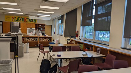 A student prepares food in the back of the culinary arts classroom. With the lack of vents, the class is forced to open the windows, which violates an LCPS rule. Photo by Liberty Harrison.  