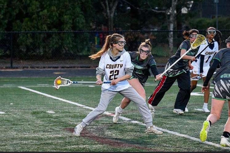 Junior Midfielder Sofie Steel keeps her eyes on the goal as she lines up her shot. 