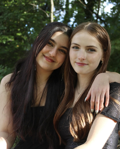  
Caption: Juniors Jana Sami and Cora Wildman pose in a photo taken by Liza Pavlenko. The photo captures the often indie and moody vibes that characterize Pavlenkos photography.