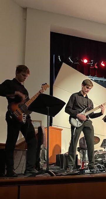 Wayne Griffin (left) and Grant McMillan (right) perform during the December 2 orchestra concert. 