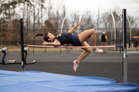 Freshman Sabrine Toumi completes a high jump at the Park View Classic on December 3. Toumi broke the school record in shot put this season. Photo by O’Neal Photography.