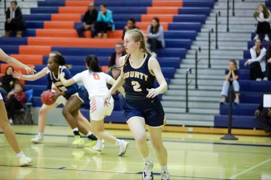 Abby Chinn runs up the court to help her teammates play against Briar Woods on November 20, 2022. Ultimately, the Captains lost the game to Briar 14-47. Photo courtesy of Kiko Dudley 