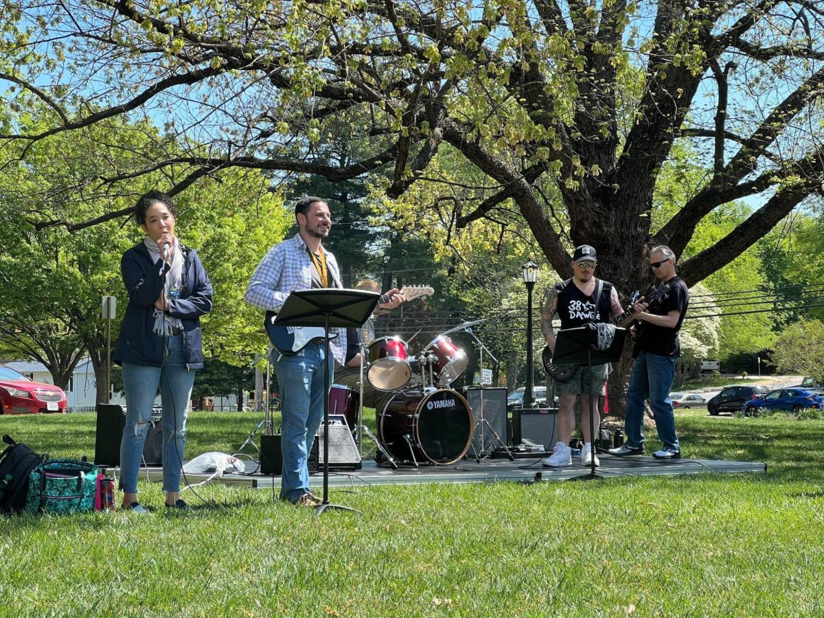 Hideko Dudley (left), Matthew Trkula (second left), Matthew Amres (behind), Phillip  DArcangelis (second right), and Richard Ricci (right) launch energetically through their set list. Staff Infection only practiced four hours before taking the stage on April 19 and Lunch On The Lawn. 