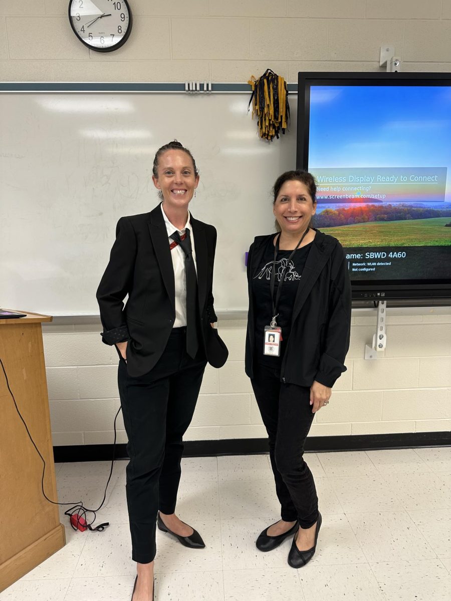 Math teachers Abby Schutte (left) and Elaine Voketaitis (right) dressed up in all black to represent Oppenheimer and show their school spirit.