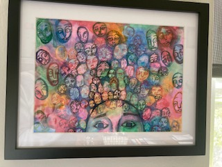 This is one of the many student artworks Luttrell enjoys keeping in her office. “I think this one’s my favorite, the colors are beautiful, and you can just see how it’s showing all the different voices going on in your head,” said Luttrell