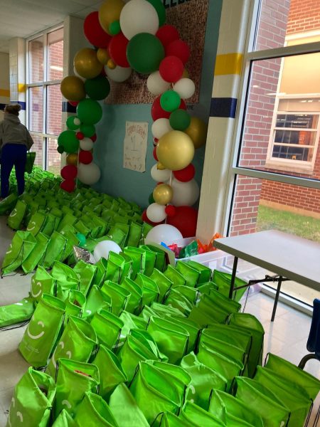 Smile kits are lined up outside the cafeteria, waiting to be packaged and delivered. The kits are given to local female cancer patients to support them as they undergo chemotherapy. 