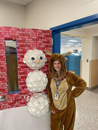 Simpson teacher Kimberly Poole poses in front of her classroom door on December 20, 2023. Poole was nominated for Loudoun Countys teacher of the year award a few weeks prior.