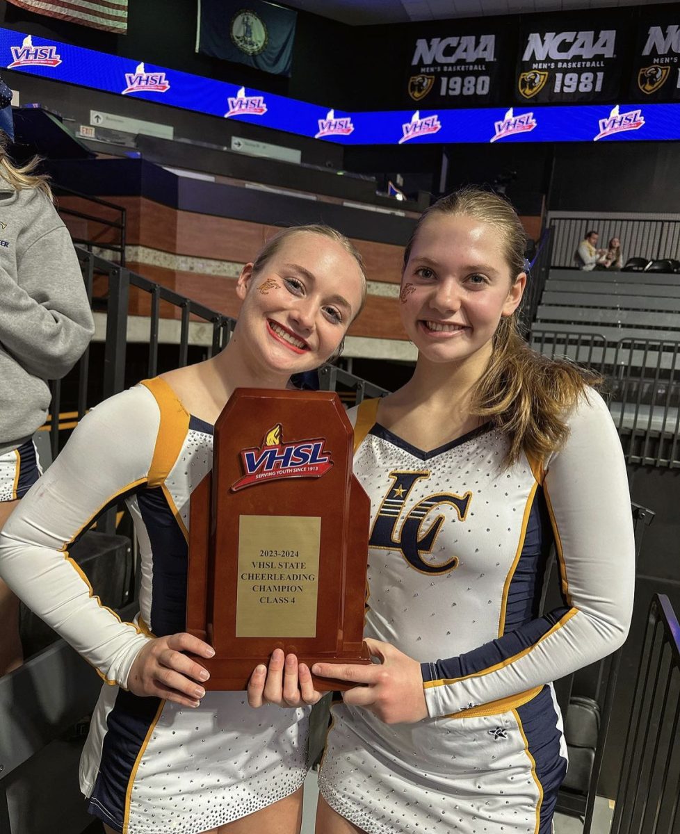 Sabrina Simpkins and Emily Pyle pose with their 2023 VHSL State Championship trophy. Simpkins is a County cheerleader and gymnast. Photo courtesy of Sabrina Simpkins on Instagram. (@sabrina.bina256)