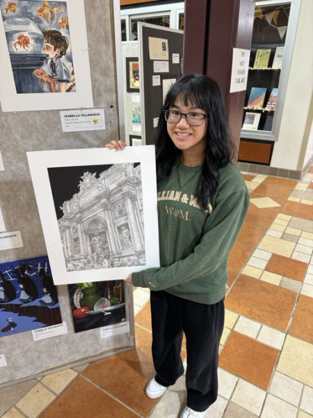 Isabella Villanueva poses with her artwork for the official announcement, which reads, “Isabella’s piece “Trevi Fountain” was selected as the 2024 Principal’s Art Gallery winner.  The artwork will be framed and displayed for future generations to enjoy in the main hallway.”