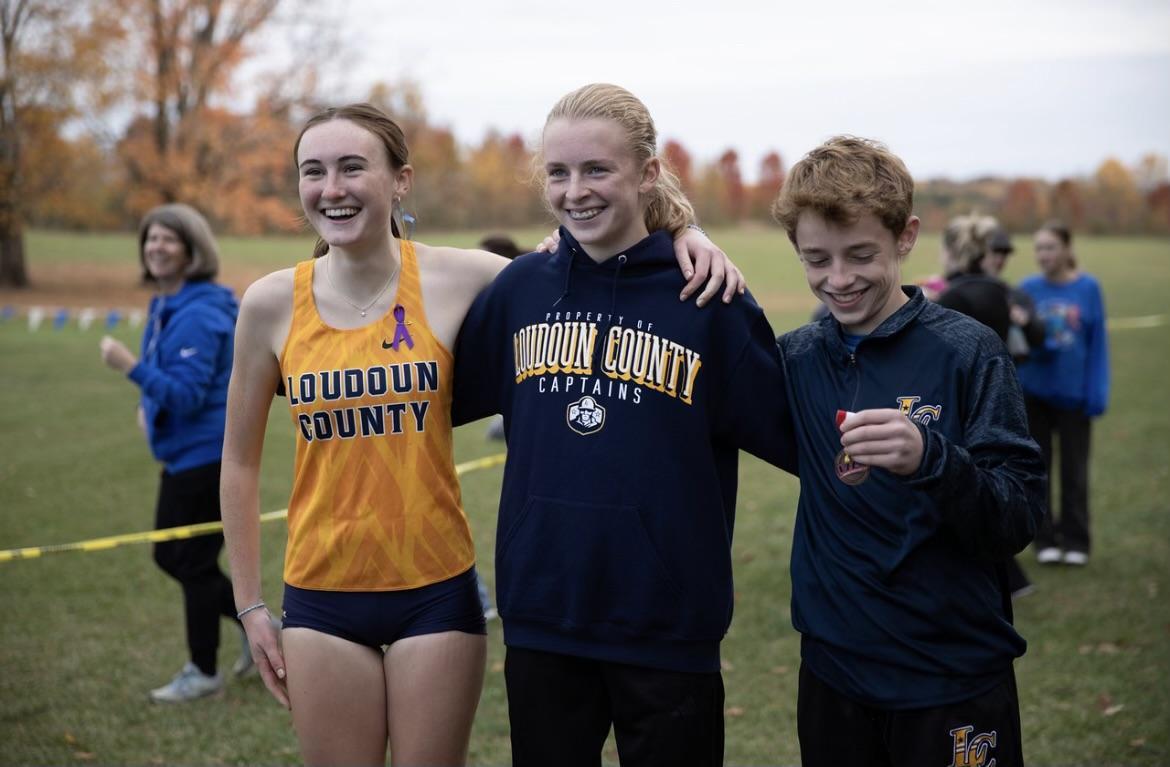 (From Left to Right) Cat Pizzarello, Fallon Fetterolf, and Michael Tafe stand together after qualifying for the State Championships. The three distance runners are all participating in Cross Country, Indoor track and Track and Field seasons.