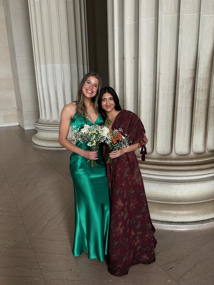 Seniors Sofia Alzate and Pia Patel hold their bouquets at the Lincoln Memorial in Washington D.C. Alzate and Patel did not attend the actual dance at the Dulles Marriott but instead opted to get together with friends at Washington D.C. Photo courtesy of Sophia Casciano. “Having a night out in DC with my friends was much easier to do,” Alzate said. “The cost of a prom ticket was pricey, and going to DC with friends was a much more flexible option.”