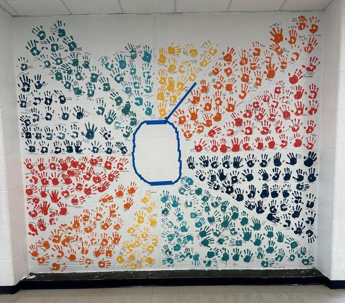 This year’s senior handprints are part of the class’ mural, which will be ‘70s themed in accordance with the 70th anniversary. The mural features bright colors in a tie-dye-esque swirl and will include other decade-appropriate designs.