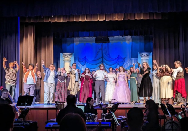 The Captains Playhouse gathers on stage for the final act of Cinderella. The students at Loudoun County put together Rogers and Hammerstein's version of Cinderella as their spring play on the final weekend of April. From left to right: Senior Kevin Jennings, Senior Anthony Velasquez, Junior Sam Takemoto, Freshman Emma Barts, Freshman Justin Goodhart, Senior Alex Mckay, Sophomore Colin Diem, Junior Frey Williams, Senior Katlyn Guevara, Sophomore Nora Lee, Freshman Grace Allred, Sophomore Grey Payne, Sophomore Rae Creppon and Freshman Emma Nicholson.