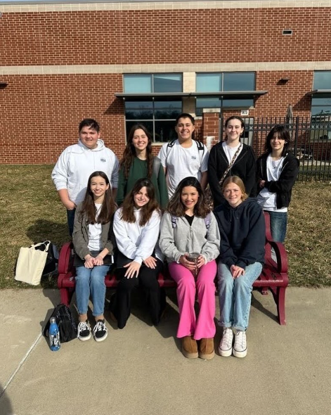 Loudoun County students gather together at Rock Ridge High School and take a picture for the District sixteen choir concert! These nine singers get picked to sing with students from all over the district. Pictured: (Left to Right) (Top) Sam Takemoto, Emma Wride, Justin Goodhart, Grace Allred, Haelie Shabanowitz, (Bottom) Syd Williams, Norah Lee, Vanessa Carranza-Chiuz and Sadie Stevens. 