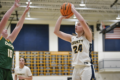 Zoe Ward shoots a basketball during a varsity girls basketball game against Loudoun Valley on December 15, 2023. 18-51 Loudoun Valley. 12/15/23.