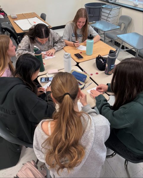 Sophomore Eimile Abbott and senior Sofia Habibzai work together to create Valentine’s Day cards to send to the Spring Arbor retirement home. Women in Entrepreneurship hopes to create an environment for innovation, collaboration, and growth through crafts and other activities.