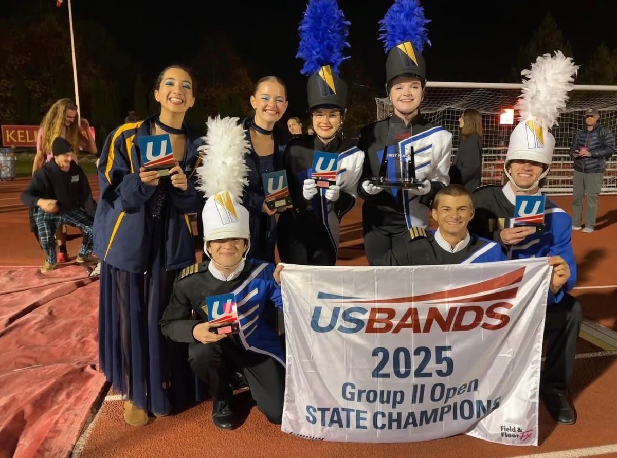 Junior Bahia Omais, Senior Amelia Cunnington, Senior Rachel Nimtz, Junior Shannon Amos, Senior Ryan Stultz, Senior Grayson Bradley, and senior Carter Cumisky of the band pose after winning states with a score of 93.9 on November 1. Photo courtesy of @LCHS1954.