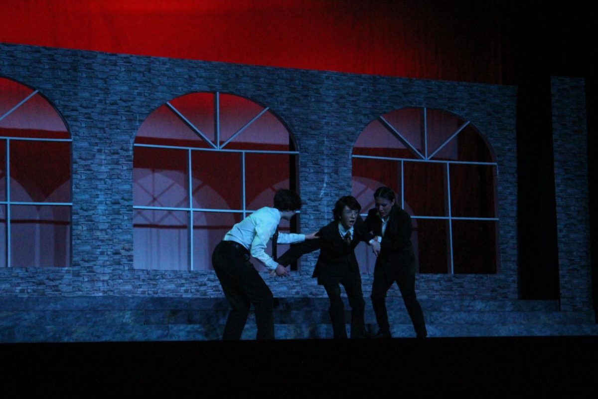 Macduff (senior Carson Phillips) is held up by Lennox (freshman Isabella Soto-Diaz) after receiving news that his wife, Lady Macduff (freshman Ali Owens), and his son (freshman Ronan Karhuse), have been murdered following Macbeth’s orders. Macduff was portrayed as a loyal Thane who later grew weary of Macbeth and his actions. 